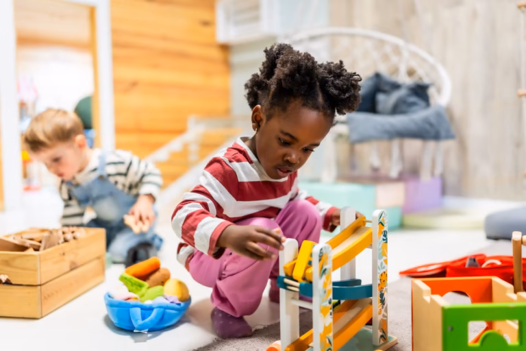 young toddler playing with toys